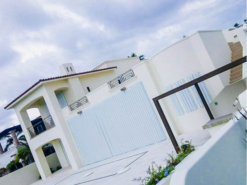 Accordion shutters for storm protection